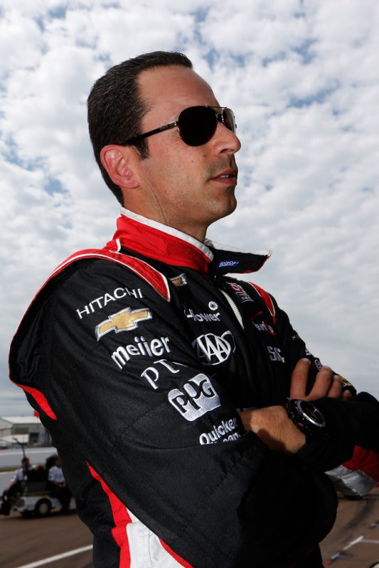 Helio Castroneves of Brazil, driver of the Hitachi Team Penske Dallara Chevrolet, looks on from pit lane prior to practice for the IZOD IndyCar Series Honda Grand Prix of St Petersburg on March 22, 2013 in St Petersburg, Florida.