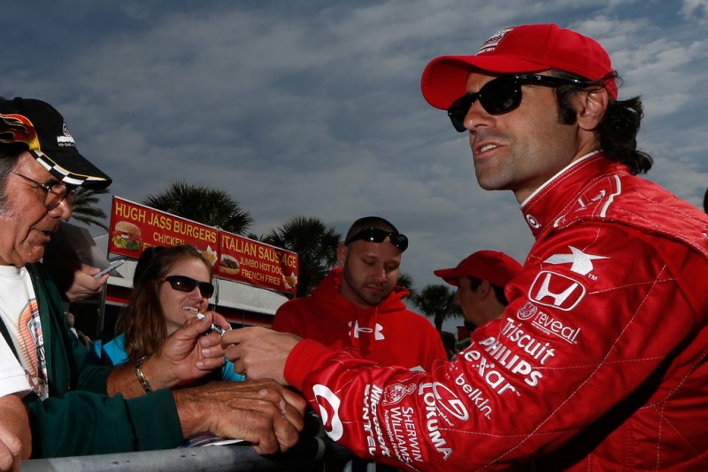 Dario Franchitti of Scotland, driver of the #10 Target Chip Ganassi Racing Dallara Honda, signs autographs for fans prior to practice for the IZOD IndyCar Series Honda Grand Prix of St Petersburg on March 22, 2013 in St Petersburg, Florida.