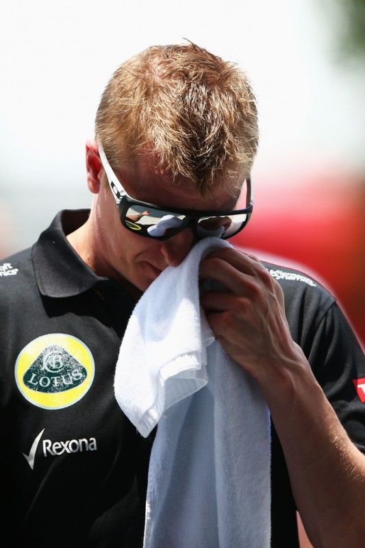 Kimi Raikkonen of Finland and Lotus walks in the paddock before the final practice session prior to qualifying for the Malaysian Formula One Grand Prix at the Sepang Circuit on March 23, 2013 in Kuala Lumpur, Malaysia.