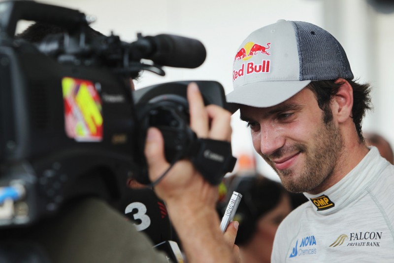 Jean-Eric Vergne of France and Scuderia Toro Rosso is interviewed by the media following qualifying for the Malaysian Formula One Grand Prix at the Sepang Circuit on March 23, 2013 in Kuala Lumpur, Malaysia.