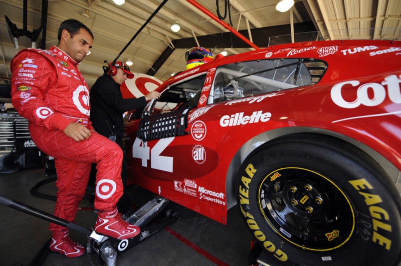 Juan Pablo Montoya, driver of the #42 Target Chevrolet, stands outside of his car during practice for the NASCAR Sprint Cup Series Auto Club 400 at Auto Club Speedway on March 22, 2013 in Fontana, California.