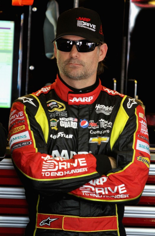 Jeff Gordon, driver of the #24 Drive To End Hunger Chevrolet, stands in the garage area during practice for the NASCAR Sprint Cup Series Auto Club 400 at Auto Club Speedway on March 22, 2013 in Fontana, California.