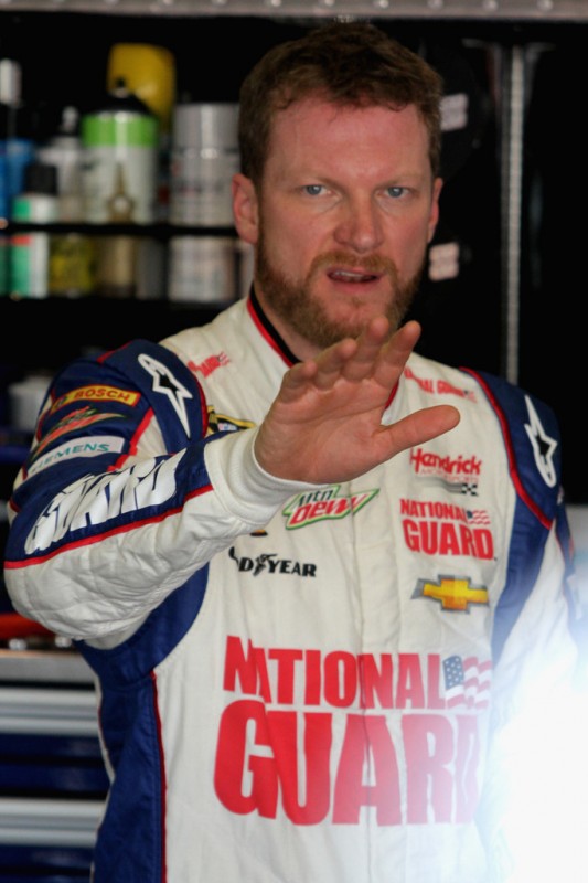 Dale Earnhardt Jr., driver of the #88 National Guard Chevrolet, signals to his crew members during practice for the NASCAR Sprint Cup Series Auto Club 400 at Auto Club Speedway on March 22, 2013 in Fontana, California.