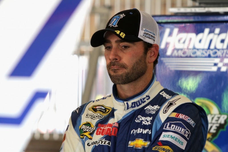 Jimmie Johnson, driver of the #48 Lowe's/Jimmie Johnson Foundation Chevrolet, stands in the garage area during practice for the NASCAR Sprint Cup Series Auto Club 400 at Auto Club Speedway on March 22, 2013 in Fontana, California.