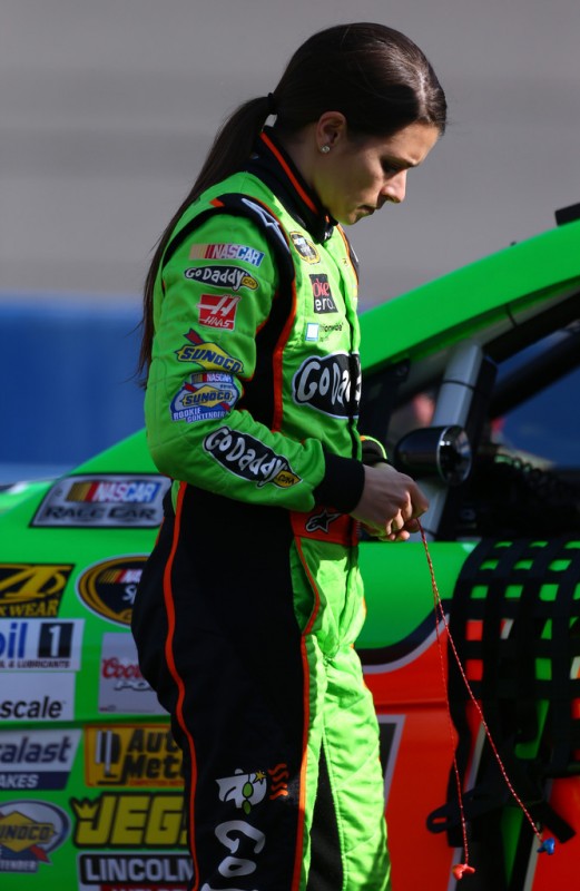 Danica Patrick, driver of the #10 GoDaddy.com Chevrolet, stands on the grid during qualifying for the NASCAR Sprint Cup Series Auto Club 400 at Auto Club Speedway on March 22, 2013 in Fontana, California. 