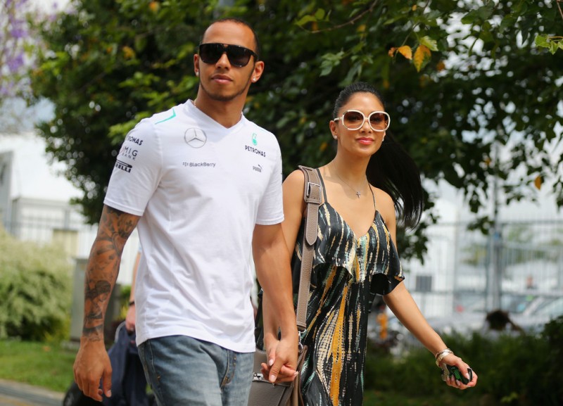 Lewis Hamilton of Great Britain and Mercedes GP and his girlfriend Nicole Scherzinger of the Pussycat Dolls arrive in the paddock before the Malaysian Formula One Grand Prix at the Sepang Circuit on March 24, 2013 in Kuala Lumpur, Malaysia. 