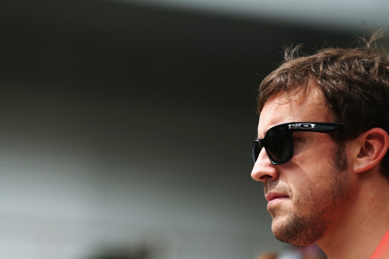 Fernando Alonso of Spain and Ferrari arrives in the paddock before the Malaysian Formula One Grand Prix at the Sepang Circuit on March 24, 2013 in Kuala Lumpur, Malaysia. 