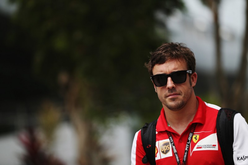 Fernando Alonso of Spain and Ferrari arrives in the paddock before the Malaysian Formula One Grand Prix at the Sepang Circuit on March 24, 2013 in Kuala Lumpur, Malaysia. 
