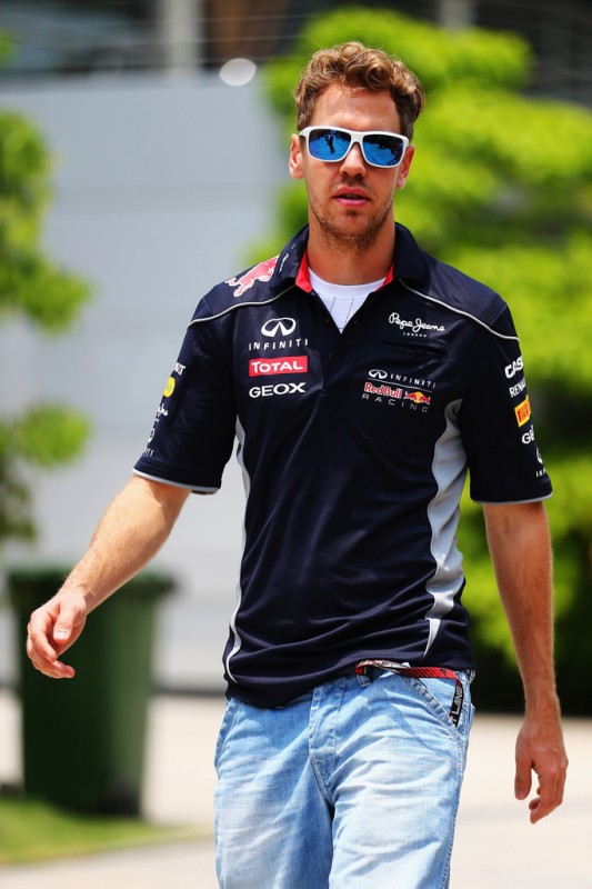 Sebastian Vettel of Germany and Infiniti Red Bull Racing arrives in the paddock before the Malaysian Formula One Grand Prix at the Sepang Circuit on March 24, 2013 in Kuala Lumpur, Malaysia. 