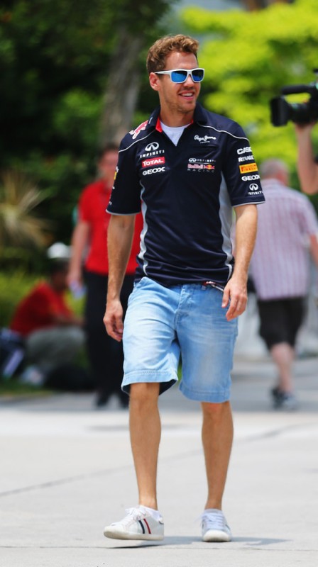 Sebastian Vettel of Germany and Infiniti Red Bull Racing arrives in the paddock before the Malaysian Formula One Grand Prix at the Sepang Circuit on March 24, 2013 in Kuala Lumpur, Malaysia. 