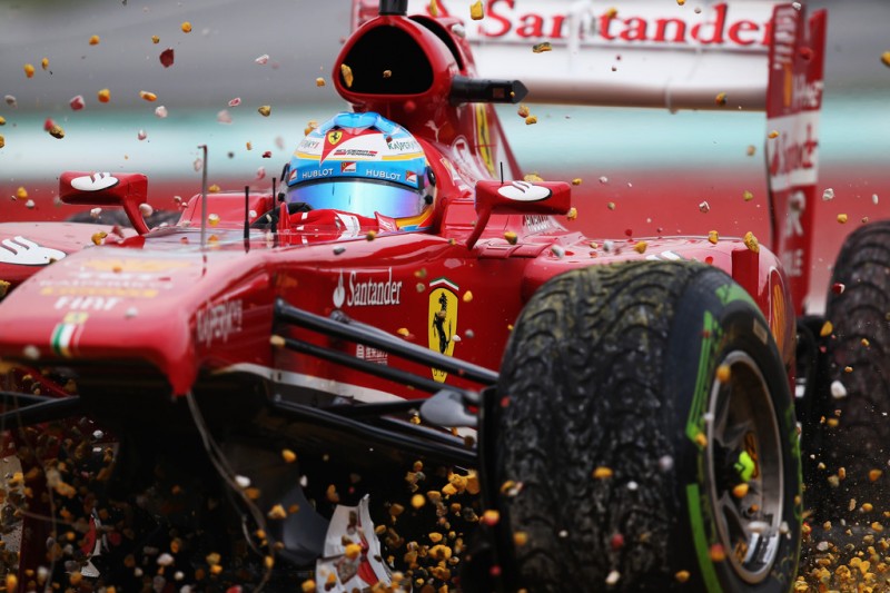 Fernando Alonso of Spain and Ferrari crashes into the gravel trap at turn one after sustaining front wing damage during the Malaysian Formula One Grand Prix at the Sepang Circuit on March 24, 2013 in Kuala Lumpur, Malaysia. 
