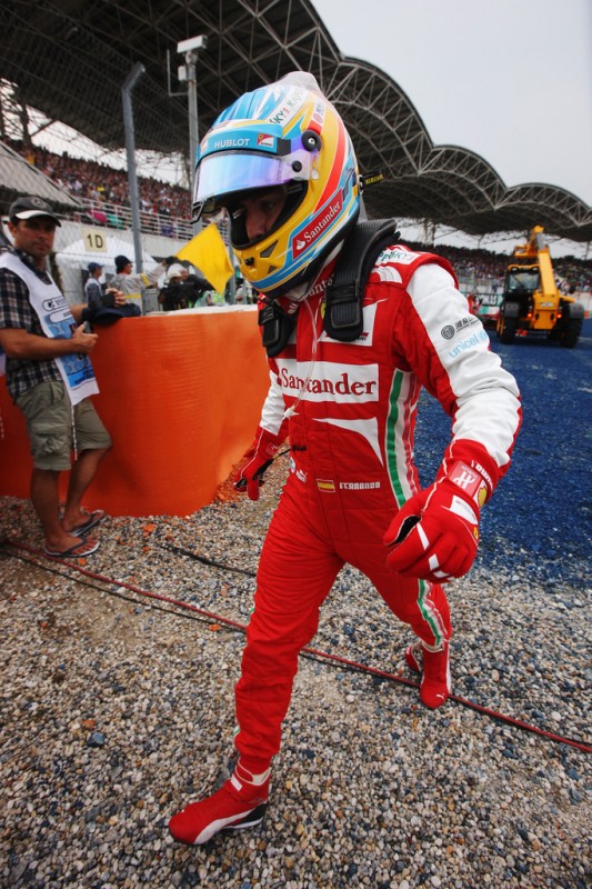 Fernando Alonso of Spain and Ferrari reacts after crashing into the gravel trap at turn one during the Malaysian Formula One Grand Prix at the Sepang Circuit on March 24, 2013 in Kuala Lumpur, Malaysia. 
