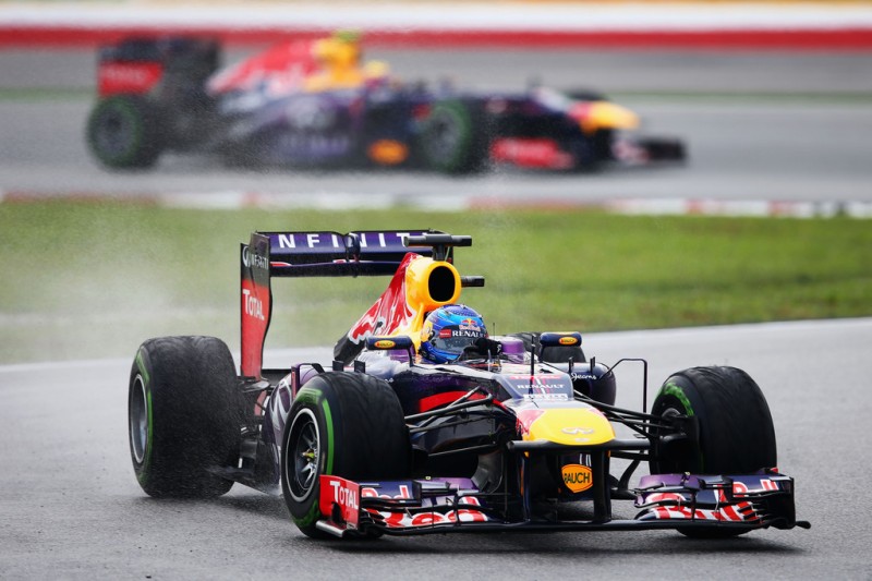 Sebastian Vettel of Germany and Infiniti Red Bull Racing leads from team mate Mark Webber of Australia and Infiniti Red Bull Racing during the Malaysian Formula One Grand Prix at the Sepang Circuit on March 24, 2013 in Kuala Lumpur, Malaysia. 