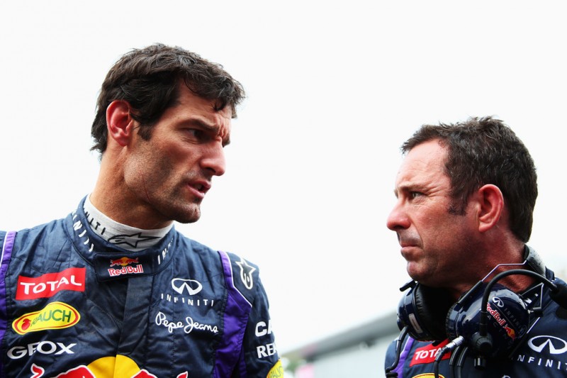 Mark Webber of Australia and Infiniti Red Bull Racing talks with Chief Mechanic Kenny Handkammer as he prepares to drive during the Malaysian Formula One Grand Prix at the Sepang Circuit on March 24, 2013 in Kuala Lumpur, Malaysia. 