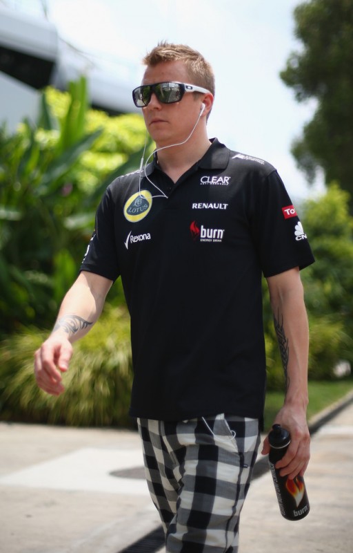 Kimi Raikkonen of Finland and Lotus attends the drivers parade before the Malaysian Formula One Grand Prix at the Sepang Circuit on March 24, 2013 in Kuala Lumpur, Malaysia. 