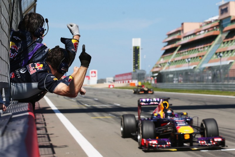 Team mates celebrate as Sebastian Vettel of Germany and Infiniti Red Bull Racing wins the German Grand Prix at the Nuerburgring on July 7, 2013 in Nuerburg, Germany. 