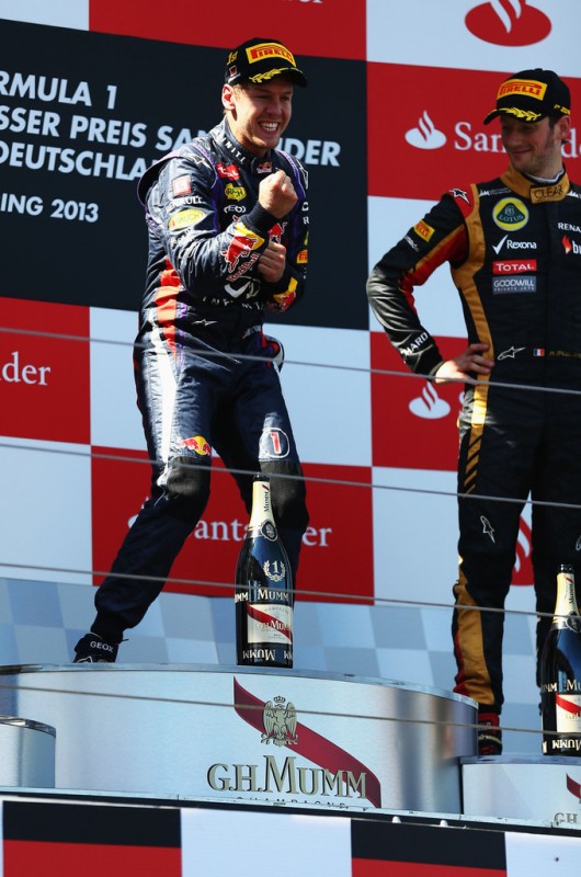 Sebastian Vettel of Germany and Infiniti Red Bull Racing celebrates on the podium after winning the German Grand Prix at the Nuerburgring on July 7, 2013 in Nuerburg, Germany. 
