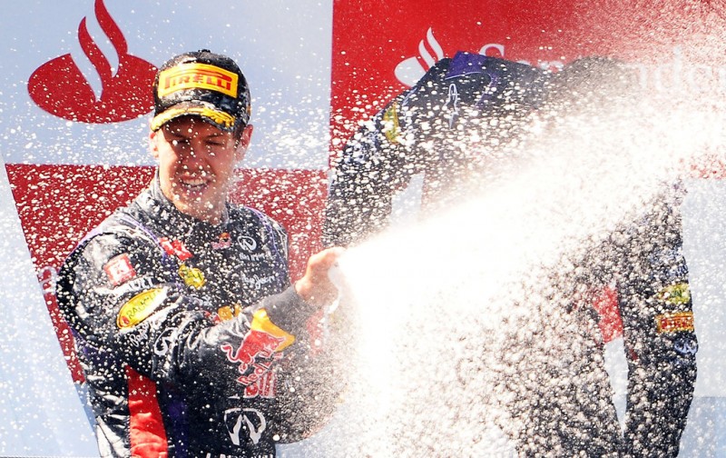 Sebastian Vettel of Germany and Infiniti Red Bull Racing celebrates on the podium after winning the German Grand Prix at the Nuerburgring on July 7, 2013 in Nuerburg, Germany. 