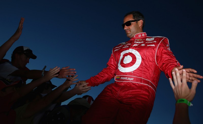 Juan Pablo Montoya, driver of the #42 Target Chevrolet, greets fans during driver introductions during the NASCAR Sprint Cup Series Coke Zero 400 at Daytona International Speedway on July 6, 2013 in Daytona Beach, Florida. 