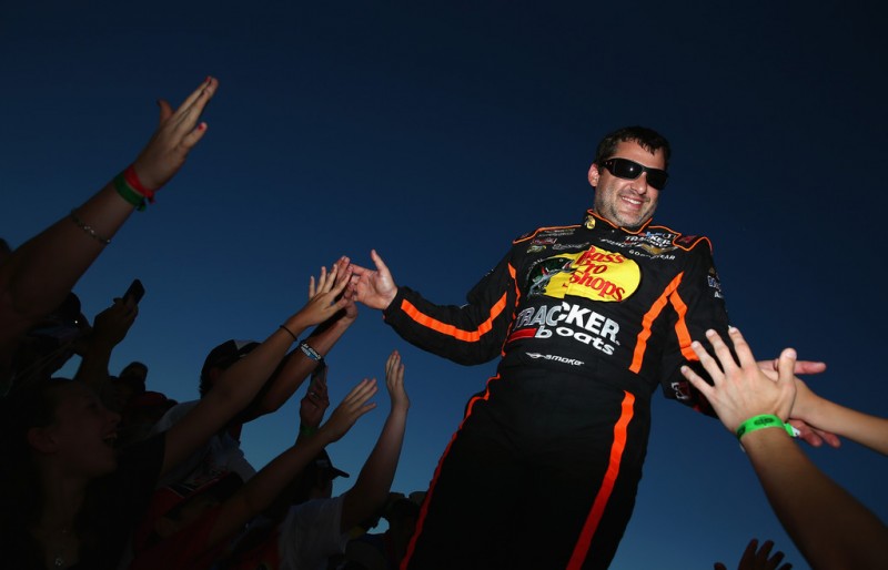 Tony Stewart, driver of the #14 Bass Pro Shops / Ducks Unlimited Chevrolet, greets fans during driver introductions during the NASCAR Sprint Cup Series Coke Zero 400 at Daytona International Speedway on July 6, 2013 in Daytona Beach, Florida. 