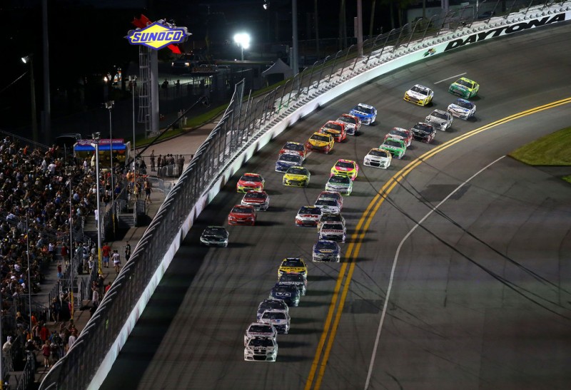 Jimmie Johnson, driver of the #48 Lowe's Dover White Chevrolet, leads a pack of cars during the NASCAR Sprint Cup Series Coke Zero 400 at Daytona International Speedway on July 6, 2013 in Daytona Beach, Florida. 