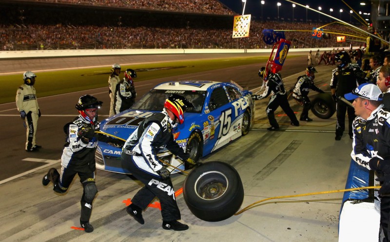 Clint Bowyer, driver of the #15 Blue DEF Diesel Exhaust Fluid Toyota, pits during the NASCAR Sprint Cup Series Coke Zero 400 at Daytona International Speedway on July 6, 2013 in Daytona Beach, Florida. 