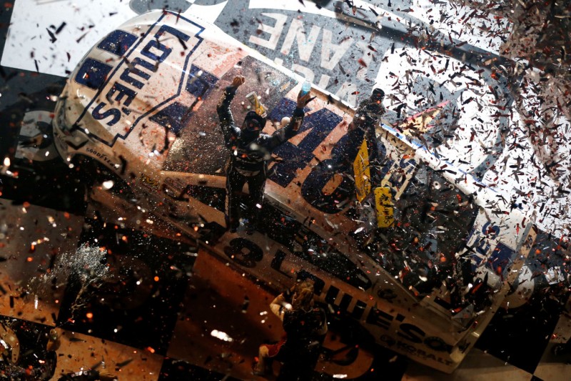 Jimmie Johnson, driver of the #48 Lowe's Dover White Chevrolet, celebrates with his crew in victory lane after winning the NASCAR Sprint Cup Series Coke Zero 400 at Daytona International Speedway on July 6, 2013 in Daytona Beach, Florida. 