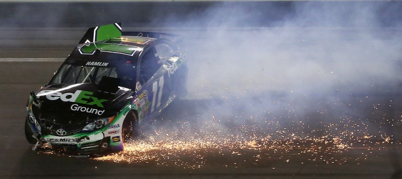 Denny Hamlin, driver of the #11 FedEx Ground Toyota, crashes during the NASCAR Sprint Cup Series Coke Zero 400 at Daytona International Speedway on July 6, 2013 in Daytona Beach, Florida. 