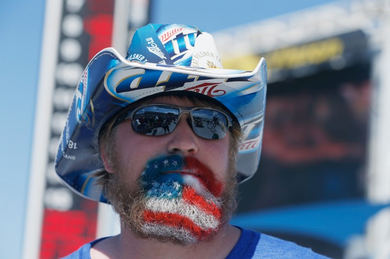 A fan poses for a photo during the NASCAR Sprint Cup Series Coke Zero 400 at Daytona International Speedway on July 6, 2013 in Daytona Beach, Florida. 
