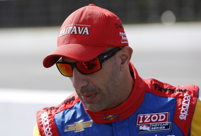 Tony Kanaan of Brazil driver of the #11 Sunoco "Turbo" KVRT-SH Racing Chevrolet stands by his car prior to practice for the Pocono INDYCAR 400 at Pocono Raceway on July 6, 2013 in Long Pond Pennsylvania. 
