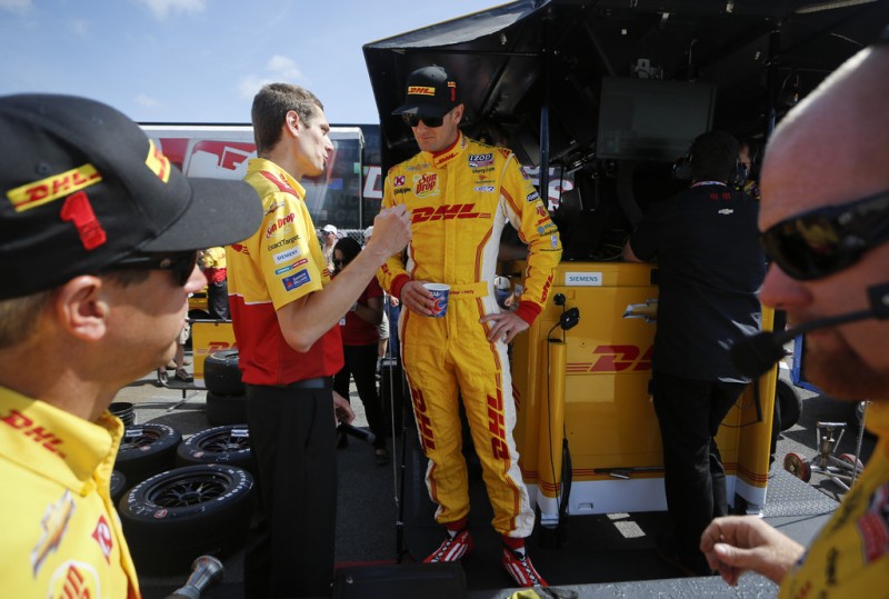 Ryan Hunter-Reay drier of the #1 DHL Chevrolet talks to a crew member during practice for the Pocono INDYCAR 400 at Pocono Raceway on July 6, 2013 in Long Pond Pennsylvania.