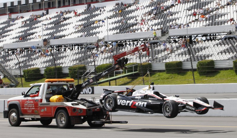 An emergency vehicle removes the #12 Verizon Team Penske of Will Power of Australia after an incident during practice for the Pocono INDYCAR 400 at Pocono Raceway on July 6, 2013 in Long Pond Pennsylvania. 