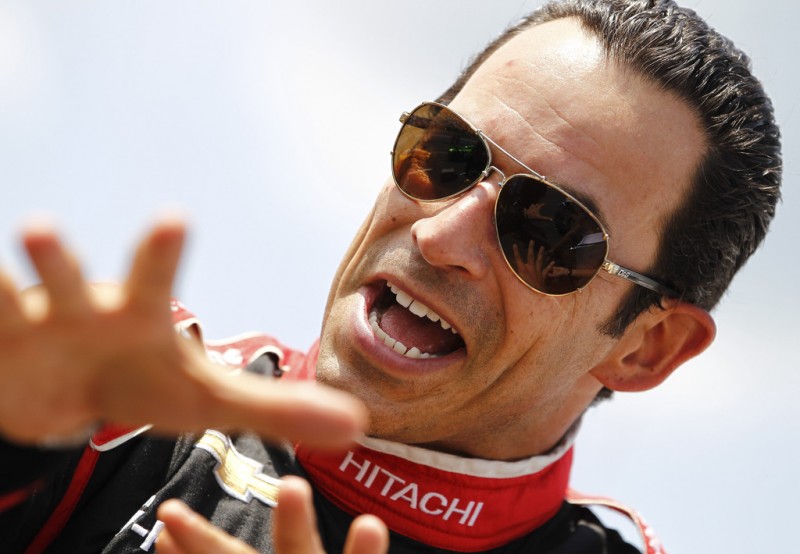 Helio Castroneves of Brazil, driver of the #3 Hitachi Team Penske stands on the grid during qualifying for the Pocono INDYCAR 400 at Pocono Raceway on July 5, 2013 in Long Pond, Pennsylvania. 