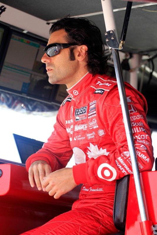 Dario Franchitti of Scotland, driver of the #10 Target Chip Ganassi Racing Honda looks on from his pit box prior to practice for the IZOD INDYCAR Series Honda Indy Toronto on July 12, 2013 in Toronto, Canada. 