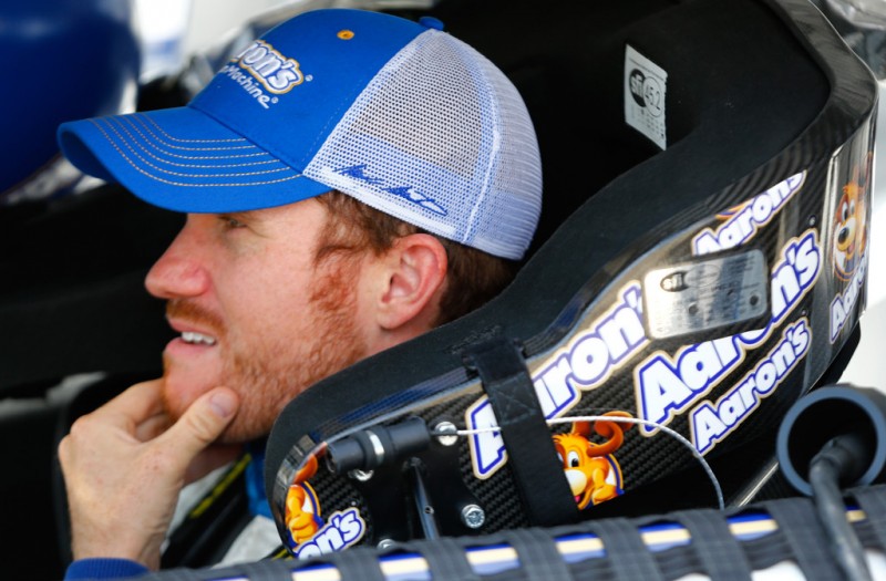 Brian Vickers, driver of the #55 Aaron's Dream Machine Toyota, sits in the car on the grid during qualifying for the NASCAR Sprint Cup Series Camping World RV Sales 301 at New Hampshire Motor Speedway on July 12, 2013 in Loudon, New Hampshire. 