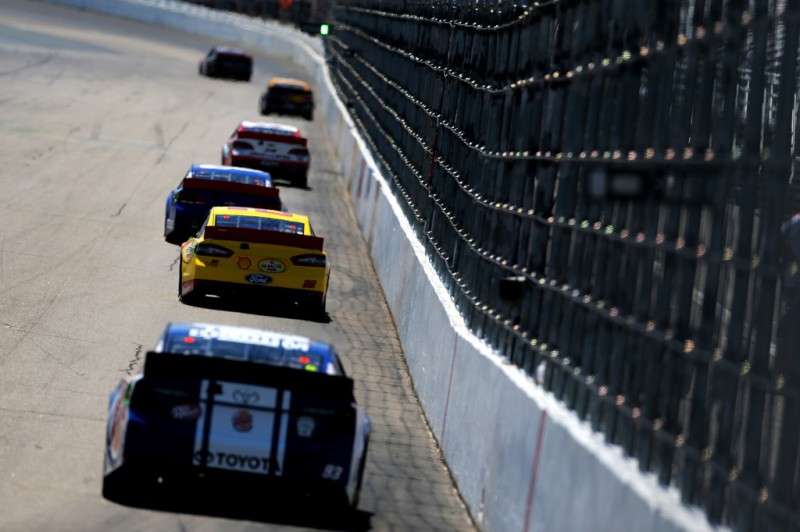Joey Logano, driver of the #22 Shell-Pennzoil/AAA Ford, and other drivers during practice for the NASCAR Sprint Cup Series Camping World RV Sales 301 at New Hampshire Motor Speedway on July 12, 2013 in Loudon, New Hampshire.
