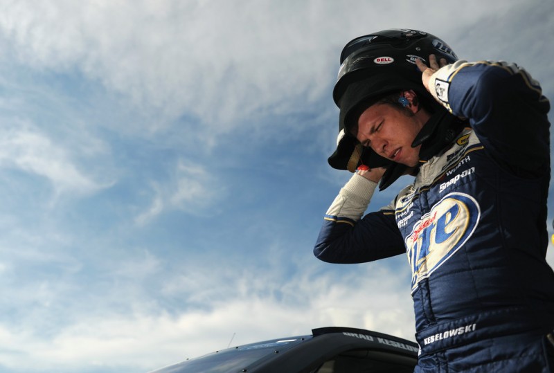 Brad Keselowski, driver of the #2 Miller Lite Ford, climbs out of his car after qualifying for the pole position in the NASCAR Sprint Cup Series Camping World RV Sales 301 at New Hampshire Motor Speedway on July 12, 2013 in Loudon, New Hampshire. 