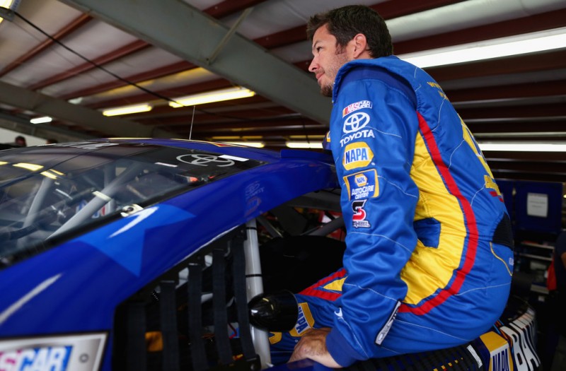 Martin Truex Jr., driver of the #56 NAPA Batteries Toyota, climbs in his car during practice for the NASCAR Sprint Cup Series Camping World RV Sales 301 at New Hampshire Motor Speedway on July 12, 2013 in Loudon, New Hampshire. 