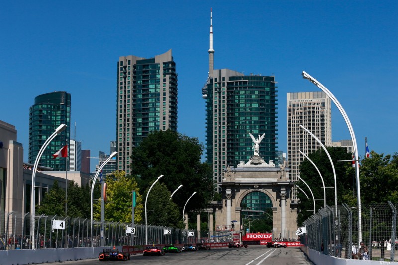 A pack of cars race during the IZOD INDYCAR Series Honda Indy Toronto Race #1 on July 13, 2013 in Toronto, Canada.