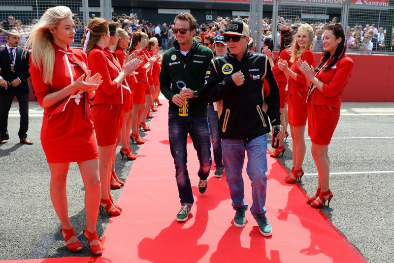 (L-R) Giedo van der Garde of the Netherlands and Caterham and Kimi Raikkonen of Finland and Lotus attend the drivers parade before the British Formula One Grand Prix at Silverstone Circuit on June 30, 2013 in Northampton, England. 