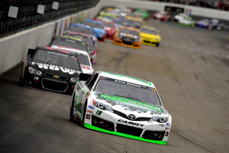 Kyle Busch, driver of the #18 Interstate Batteries Toyota, leads the field during the NASCAR Sprint Cup Series Camping World RV Sales 301 at New Hampshire Motor Speedway on July 14, 2013 in Loudon, New Hampshire. 