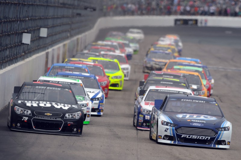 Brad Keselowski, driver of the #2 Miller Lite Ford, and Kurt Busch, driver of the #78 Furniture Row/Denver Mattress Chevrolet, lead the field to start the NASCAR Sprint Cup Series Camping World RV Sales 301 at New Hampshire Motor Speedway on July 14, 2013 in Loudon, New Hampshire. 