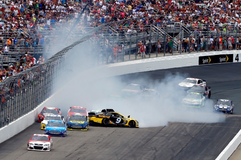 Marcos Ambrose, driver of the #9 Stanley Ford, spins out after an incident in the NASCAR Sprint Cup Series Camping World RV Sales 301 at New Hampshire Motor Speedway on July 14, 2013 in Loudon, New Hampshire. 