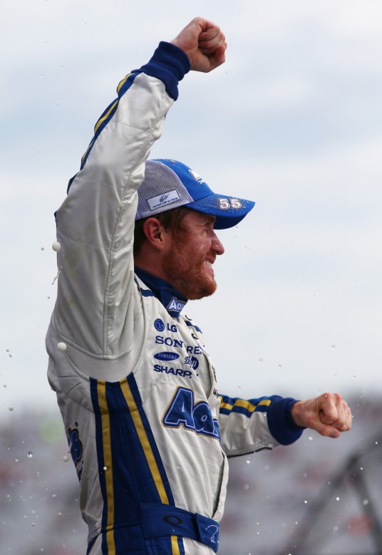 Brian Vickers, driver of the #55 Aaron's Dream Machine Toyota, celebrates in Victory Lane after winning the NASCAR Sprint Cup Series Camping World RV Sales 301 at New Hampshire Motor Speedway on July 14, 2013 in Loudon, New Hampshire. 