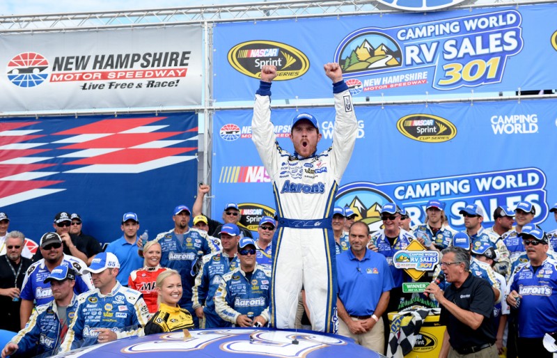 Brian Vickers, driver of the #55 Aaron's Dream Machine Toyota, celebrates in Victory Lane after winning the NASCAR Sprint Cup Series Camping World RV Sales 301 at New Hampshire Motor Speedway on July 14, 2013 in Loudon, New Hampshire. 