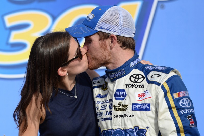 Brian Vickers, driver of the #55 Aaron's Dream Machine Toyota, celebrates with fiance Sarah Kensington in victory lane after winning the NASCAR Sprint Cup Series Camping World RV Sales 301 at New Hampshire Motor Speedway on July 14, 2013 in Loudon, New Hampshire. 
