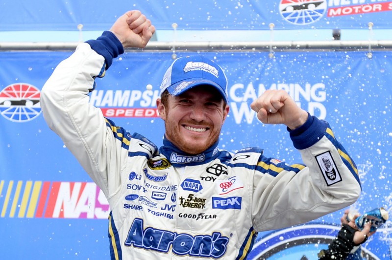 Brian Vickers, driver of the #55 Aaron's Dream Machine Toyota, celebrates in Victory Lane after winning the NASCAR Sprint Cup Series Camping World RV Sales 301 at New Hampshire Motor Speedway on July 14, 2013 in Loudon, New Hampshire. 