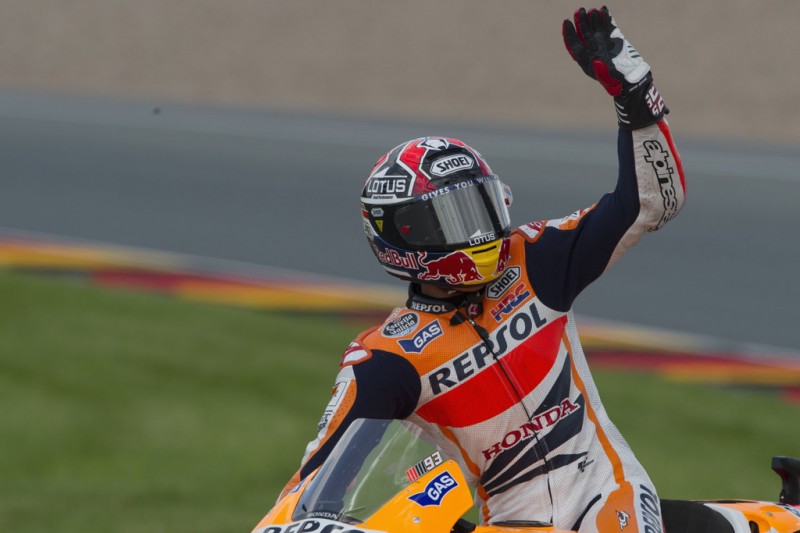 Marc Marquez of Spain and Repsol Honda Team greets the fans and celebrates the victory at the end of the MotoGP race during the MotoGp of Germany - Race at Sachsenring Circuit on July 14, 2013 in Hohenstein-Ernstthal, Germany. 