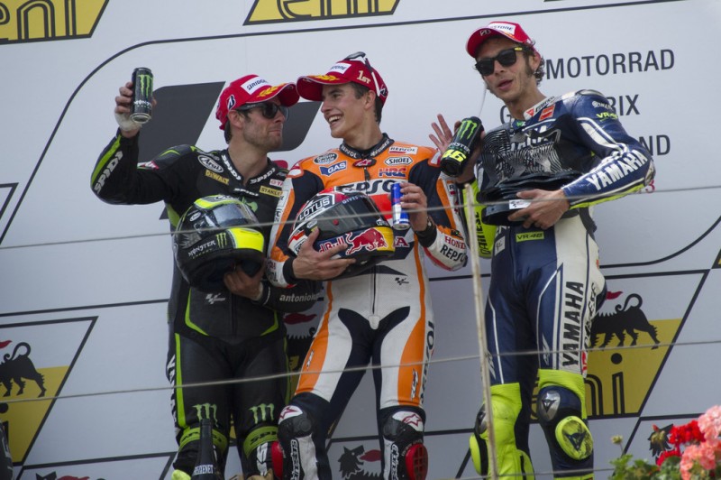 (L-R) Cal Crutchlow of Great Britain and Monster Yamaha Tech 3, Marc Marquez of Spain and Repsol Honda Team and Valentino Rossi of Italy and Yamaha Factory Racing pose on the podiun at the end of the MotoGP race during the MotoGp of Germany - Race at Sachsenring Circuit on July 14, 2013 in Hohenstein-Ernstthal, Germany. 