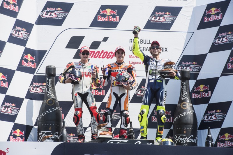 (L-R) Stefan Bradl of Germany and LCR Honda MotoGP, Marc Marquez of Spain and Repsol Honda Team and Valentino Rossi of Italy and Yamaha Factory Racing pose on the podium at the end of the MotoGP race during the MotoGp Red Bull U.S. Grand Prix - Race at Mazda Raceway Laguna Seca on July 21, 2013 in Monterey, California. 
